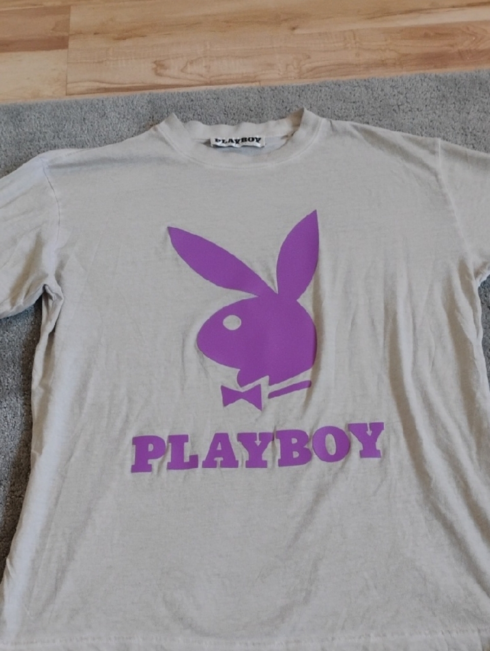 PLAYBOY  By Pac Sun Short Sleeve Tee in Beige with Purple Logo. Men's Medium.